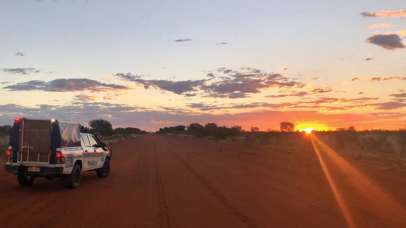 Police car in a sunset